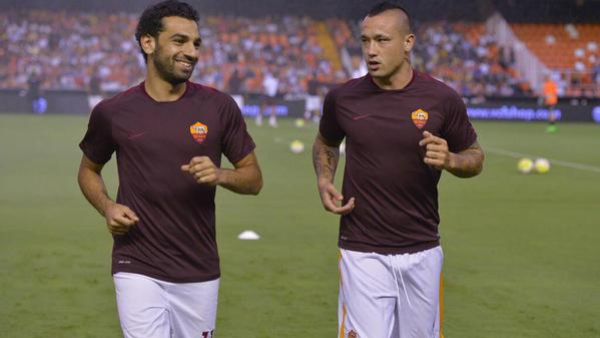 Salah and teammate Radja Nainggolan warm-up ahead of Roma's 3-1 win over Valencia