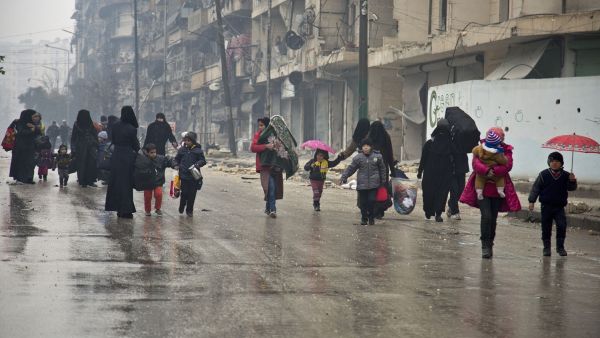 Picking up the pieces: Families in Aleppo roam the streets in search of better amenities (AFP/File Photo)	