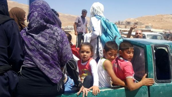 Syrian refugees arrive in Wadi Hamayyed, on the outskirts of Lebanon’s northeastern border town of Arsal. (AFP/ File Photo)