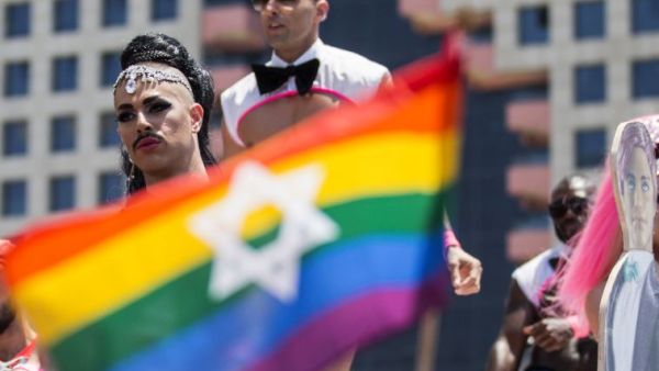 Performers dance on a stage during 2014's Tel Aviv Pride festival, which attracted nearly 200,000 party-goers.  (AFP/Jack Guez)