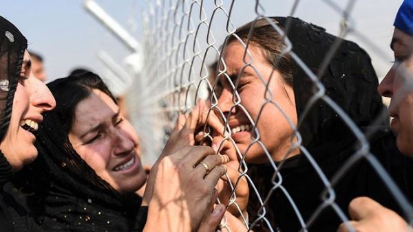 Displaced Iraqis reunite with relatives on October 26, 2016 as battle for Mosul forces thousands to flee their homes. (AFP/ Bulent Kilic) Displaced Iraqis reunite with relatives on October 26, 2016 as battle for Mosul forces thousands to flee their homes. (AFP/ Bulent Kilic)