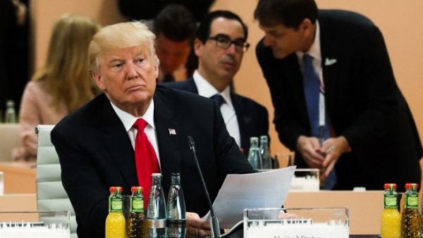 US President Donald Trump attends a working session during the G20 summit in Hamburg on July 8, 2017. (Markus Schreiber/ AFP) US President Donald Trump attends a working session during the G20 summit in Hamburg on July 8, 2017. (Markus Schreiber/ AFP)