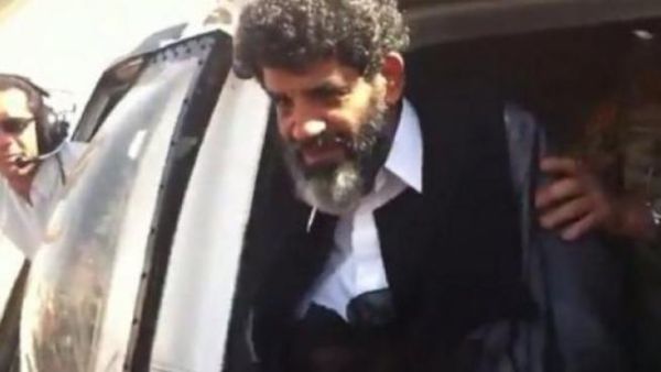 Abdullah al-Senussi arrives at a prison in Tripoli on September 5, 2012 (AFP file photo)