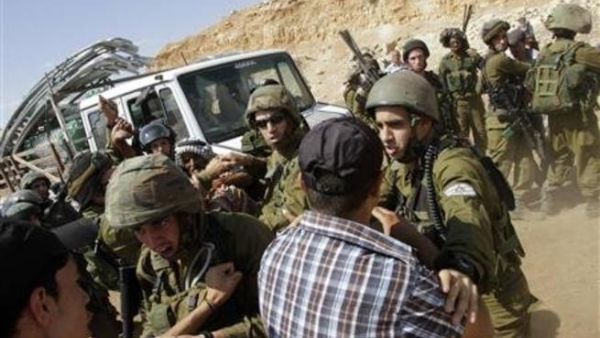 French diplomat Marion Fesneau-Castaing on the ground among Israeli soldiers in last week's scuffle in the West Bank (Courtesy of Abed Omar Qusini/Reuters)