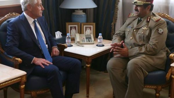 US Secretary of Defense Chuck Hagel (L) meets with Minister of Defense of Qatar, Hamid bin Ali Al-Attiyah, at the Defense Headquarters, on December 10, 2013 at Doha, Qatar. [AFP]