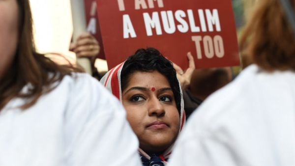 Protesters march in New York's Times Square in solidarity with American Muslims and against the travel ban ordered by US President Donald Trump on February 19, 2017. (AFP/Timothy A. Clary)