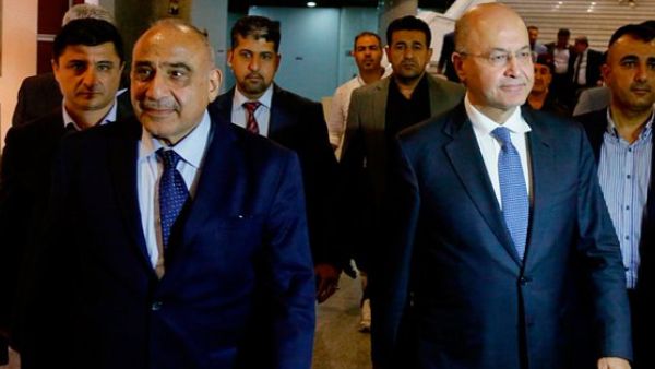 Iraq's new President Barham Salih, right, with new prime minister Adel Abdul Mahdi, left (Twitter)