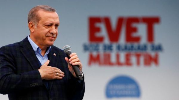 Turkish President Tayyip Erdogan (C) exits a polling booth prior to cast his ballot at a polling station during the municipal elections in Istanbu (AFP)