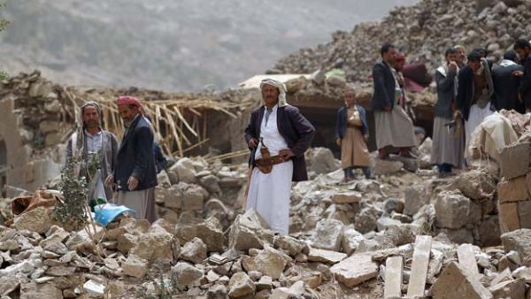 Yemeni civilians look through the rubble of their homes after an airstrike west of the capital in 2015. (AFP/File)