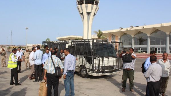 People stand outside the International Airport of the southern city of Aden on June 6, 2016. Militants attacked the airport earlier in the day, sparking a firefight that killed at least one civilian, a security source said. (AFP/Saleh al-Obeidi)