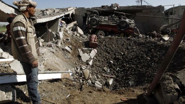 Yemenis check the destruction following a reported airstrike by Saudi-led coalition airplanes in the capital Sanaa on September 4, 2016. (AFP/Mohammed Huwais)