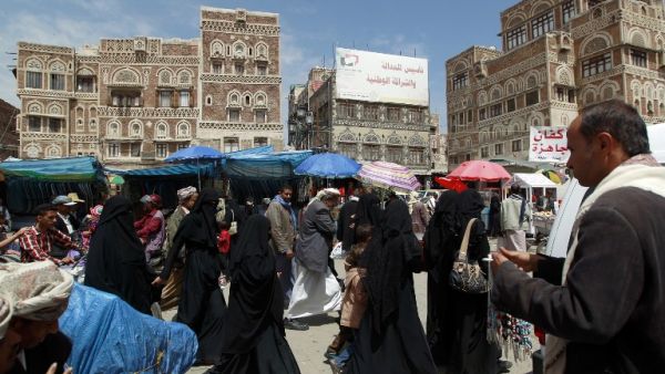 Yemenis shop at a market in the old city of the capital Sanaa on May 5, 2016. (AFP/Mohammed Huwais)