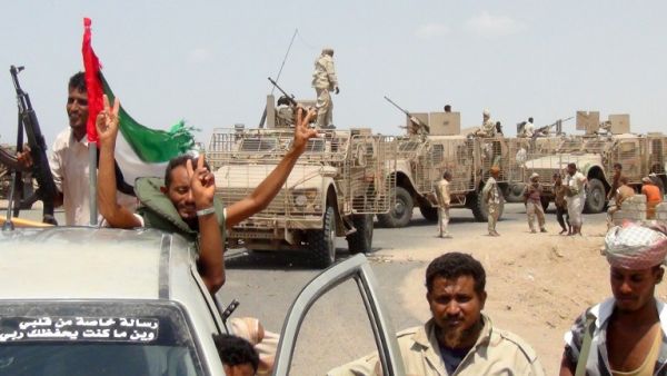 Armed Yemeni tribesmen from the Popular Resistance Committees, forces loyal to President Abd-Rabbu Mansour Hadi, flash the sign of victory on their armored vehicles on October 9, 2015 in the Dhubab district in Taiz province as they advance toward the Red Sea city of Mocha. (AFP/Nabil Hassan)