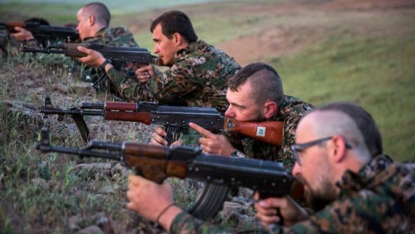 Foreign fighters with the YPG train with long-barreled firearms. (AFP/File) Foreign fighters with the YPG train with long-barreled firearms. (AFP/File)