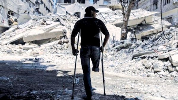 Near a building that was destroyed following air strike in Syria's eastern Ghouta (AFP/File Photo)