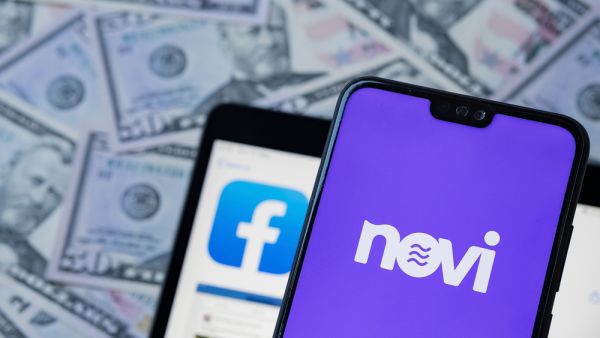 Novi logo on smartphone, facebook app and dollar banknotes on the blurred background. Novi is a rebranded Facebook Calibra wallet. (Shutterstock) Crypto News Recap: Facebook to launch Crypto Wallet