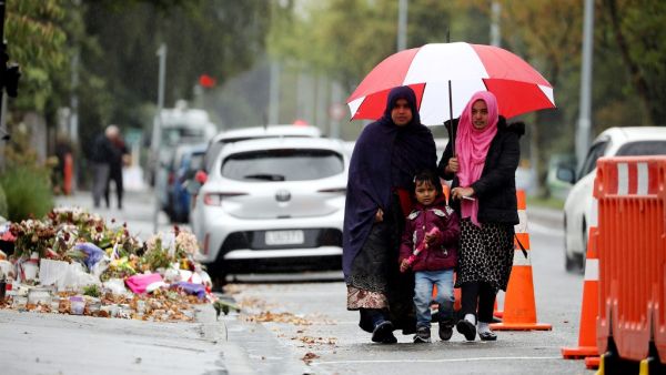 Members of the Muslim community arrive for Friday prayers (AFP)