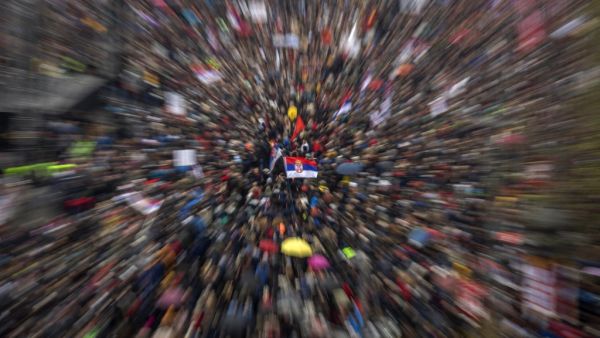 Thousands of people from all over Serbia gathering in front of the National Assembly building in central Belgrade to protest against Serbian President and to demand free media and fair elections (AFP)
