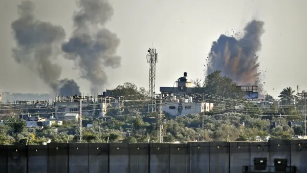 A picture taken from the southern Israeli village of Netiv Haasara shows an explosion and smoke fumes caused by an Israeli airstike across the border in the Gaza Strip (AFP)