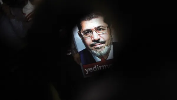  A poster of Egypt's President Mohamed Morsi is seen during a pro-Morsi demonstration in Istanbul (AFP)