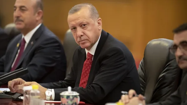 Turkish President Recep Tayyip Erdogan (C) sits during a meeting with Chinese President Xi Jinping at the Great Hall of the People in Beijing on July 2, 2019.  Mark Schiefelbein / POOL / AFP
