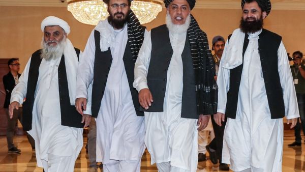 Mohammad Nabi Omari (C-L), a Taliban member formerly held by the US at Guantanamo Bay and reportedly released in 2014 in a prisoner exchange, Taliban negotiator Abbas Stanikzai (C-R), and former Taliban intelligence deputy Mawlawi Abdul Haq Wasiq (R) walk with another Taliban member during the second day of the Intra Afghan Dialogue talks in the Qatari capital Doha  (AFP)
