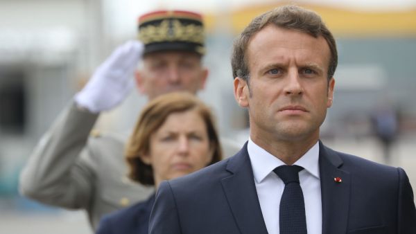 French President Emmanuel Macron takes part in a military ceremony before the official launch of the new French nuclear submarine "Suffren" built by Naval Group at the French naval base (AFP)