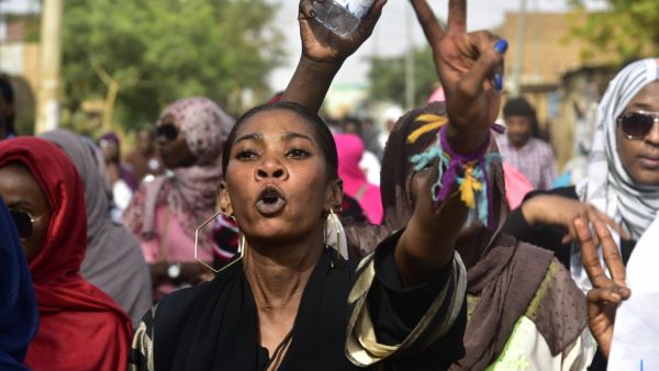 Sudanese protesters take part in a demonstration the Sudanese capital's twin city of Omdurman, to mourn dozens of demonstrators killed last month in a brutal raid on a Khartoum  (AFP)