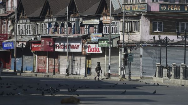 An Indian paramilitary trooper patrols along an empty street during a strict curfew in Lal Chowk area of Srinagar on the 8th day of Muharram (AFP) An Indian paramilitary trooper patrols along an empty street during a strict curfew in Lal Chowk area of Srinagar on the 8th day of Muharram (AFP)