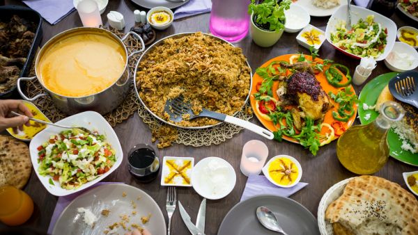 Top view of Muslim family gathering for eating iftar food in Ramadan (Shutterstock)	