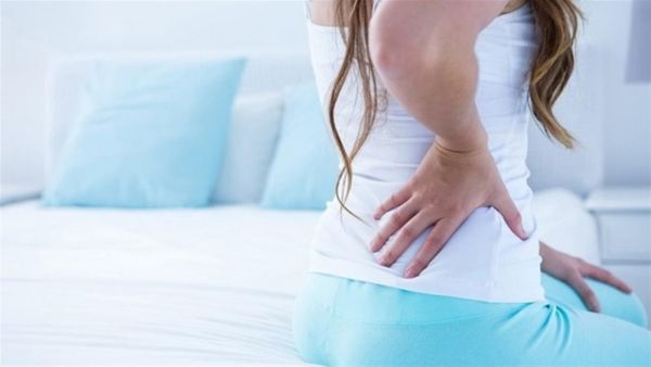 هل وجع الظهر حمل أم دورة والأسباب المؤدية له