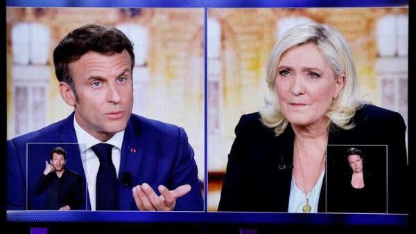 Macron Warns Le Pen She Risks ‘Civil War’ by Banning Hijab