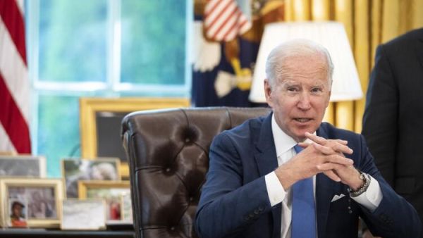 U.S. President Joe Biden speaks to reporters before signing the Ukraine Democracy Defense Lend-Lease Act of 2022 in the Oval Office of the White House May 9, 2022 in Washington, DC. The Ukraine Democracy Defense Lend-Lease Act of 2022 was unanimously passed by the U.S. Senate on April 7 and will expedite military aide and other resources to Ukraine. Drew Angerer/Getty Images/AFP Biden Rebukes Syrian Regime, Assad in Emergency Status Extension Letter