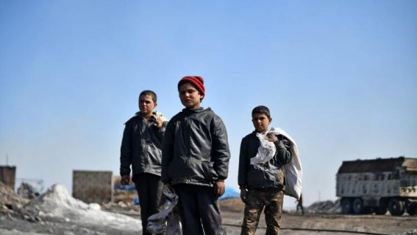 In Pictures: Syrian Children Work at Oil Refinery to Get By