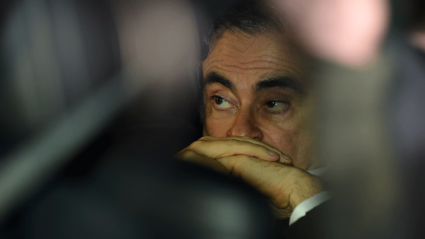 This file photo taken on March 6, 2019 shows former Nissan chairman Carlos Ghosn leaving his lawyers' offices after he was released earlier in the day from a detention centre after posting bail in Tokyo. Carlos Ghosn's escape from Japan is "unjustifiable" and he is thought to have left the country using "illegal methods", the Japanese justice minister said on January 5, 2020, in the first official public comments on the case. (AFP) Nissan Vows to Continue Legal Action Against Ghosn After His 'Extremely Regrettable' Escape