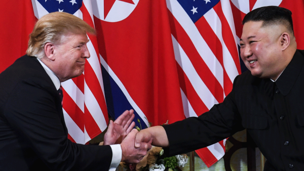 President Donald Trump shakes hands with North Korea's leader Kim Jong Un following a meeting in Hanoi. 