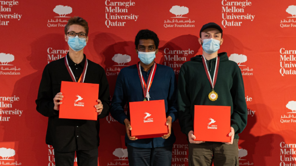 The winning team: first-year student Andrey Genze, and juniors Igli Mlloja and Abubakr Mohamed. Carnegie Mellon Hosts Qatar Collegiate Programming Competition