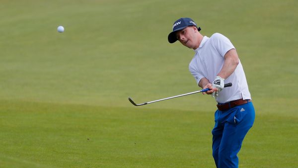Brendan Lawlor of Ireland chips onto the 18th green during the EDGA Scottish Open