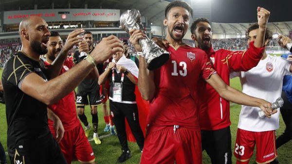 Bahrain's players celebrate after winning the 24th Arabian Gulf Cup Final football match between Bahrain and Saudi Arabia at the Khalifa International Stadium in the Qatari capital Doha on December 8, 2019.