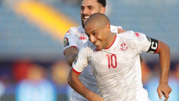  Mouez Hassen made a calamitous mistake against Mali, but Wahbi Khazri's deflected free-kick earned Tunisia a 1-1 draw in Group E. 