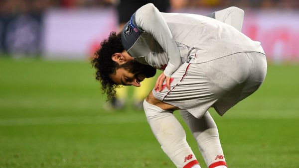 Salah went down after colliding with Newcastle goalkeeper Dubravka in the second half