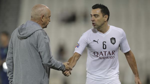 Coach Jesualdo Ferreira and Xavi