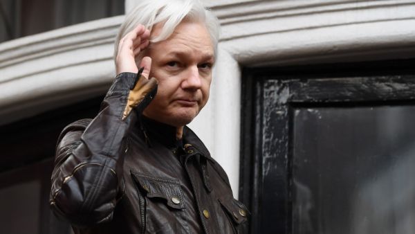 Wikileaks founder Julian Assange speaks on the balcony of the Embassy of Ecuador in London. (Justin TALLIS / AFP)