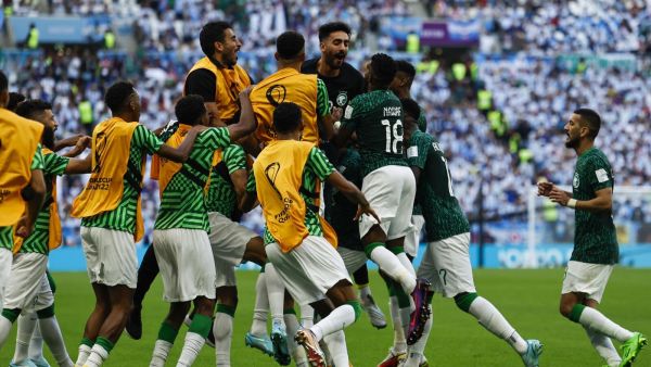 Saudi Arabia's midfielder #10 Salem Al-Dawsari (C) celebrates with teammates after scoring his team's second goal during the Qatar 2022 World Cup Group C football match between Argentina and Saudi Arabia at the Lusail Stadium in Lusail, north of Doha on November 22, 2022. (Photo by Khaled DESOUKI / AFP) Saudi Arabia