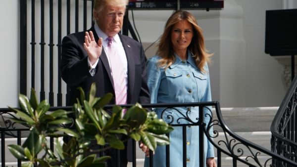 US President Donald Trump walks with First Lady Melania Trump in Washington, DC on April 22, 2019.  MANDEL NGAN / AFP