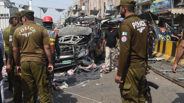 Pakistani security officials examine the site of a bomb blast outside a Sufi shrine in Lahore on May 8, 2019. (AFP/ File)