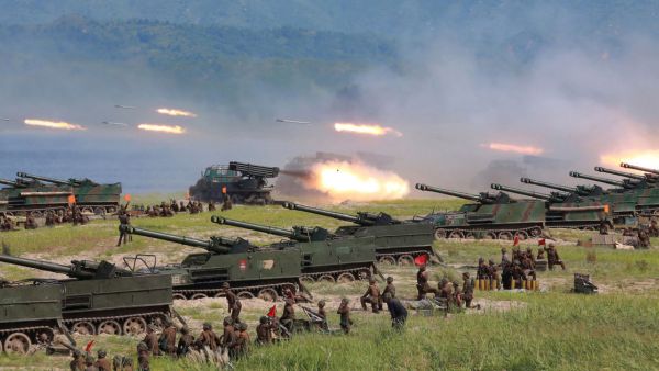 Korean People's Army (KPA) personnel launch missiles during a target strike exercise at an undisclosed location in North Korea. (AFP)