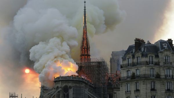 Smoke and flames rise during a fire at the landmark Notre-Dame Cathedral in central Paris on April 15, 2019, potentially involving renovation works being carried out at the site, the fire service said. Geoffroy VAN DER HASSELT / AFP