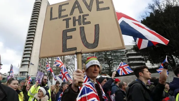 Protesters hold up placards and Union flags as they attend a pro-Brexit demonstration promoted by UKIP in central London. (AFP/ File)