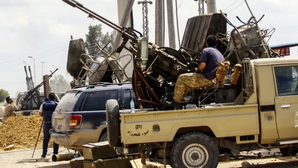 Fighters man turrets in technicals (pickup trucks mounted with turrets) stationed at a position held by forces loyal to Libya's Government of National Accord (GNA) in the suburb of Wadi Rabie. (AFP/ File Photo)